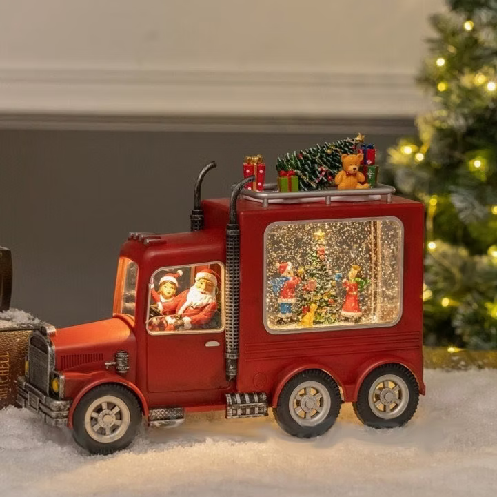 Novogodisnji kamion sa deda mrazom muzikom i svetlom