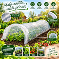 A clear plastic tunnel-style garden cover shown draped over a row of green plants in a garden bed, with multiple callout circles and text in Slovak highlighting features such as tear-away film, durable construction, and 3-meter length. The scene includes soil, vegetables, and a blurred garden background.