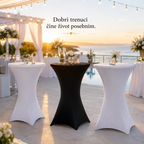 Three high bar stools covered in white and black stretch table covers are arranged on an outdoor terrace at sunset, with champagne flutes on the center stool and decorative flowers. Text in the upper center reads 'Dobri trenuci Čhe ďvivot posebnim.